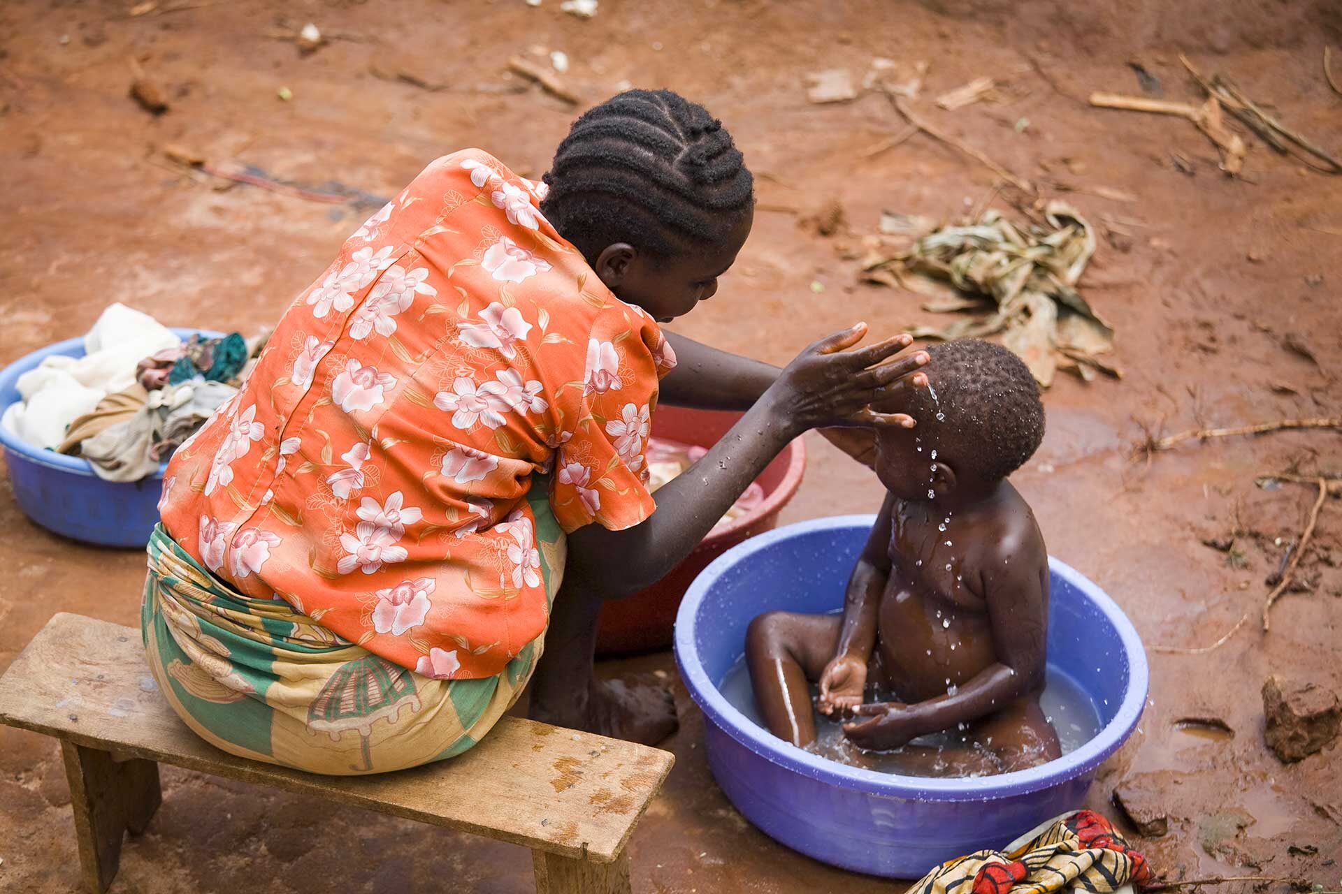 a-tender-moment-of-a-mother-washing-her-child-outd-2024-07-08-21-19-31-utc