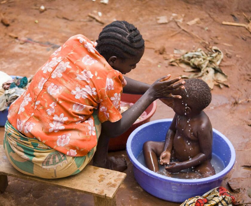 a-tender-moment-of-a-mother-washing-her-child-outd-2024-07-08-21-19-31-utc