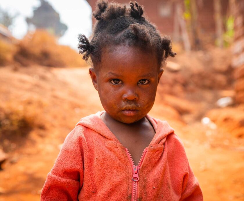 poor-little-girl-wearing-dirty-clothes-in-an-afric-2023-11-27-05-25-58-utc